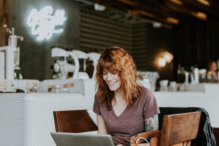 cafe owner working to improve her online scheduling software